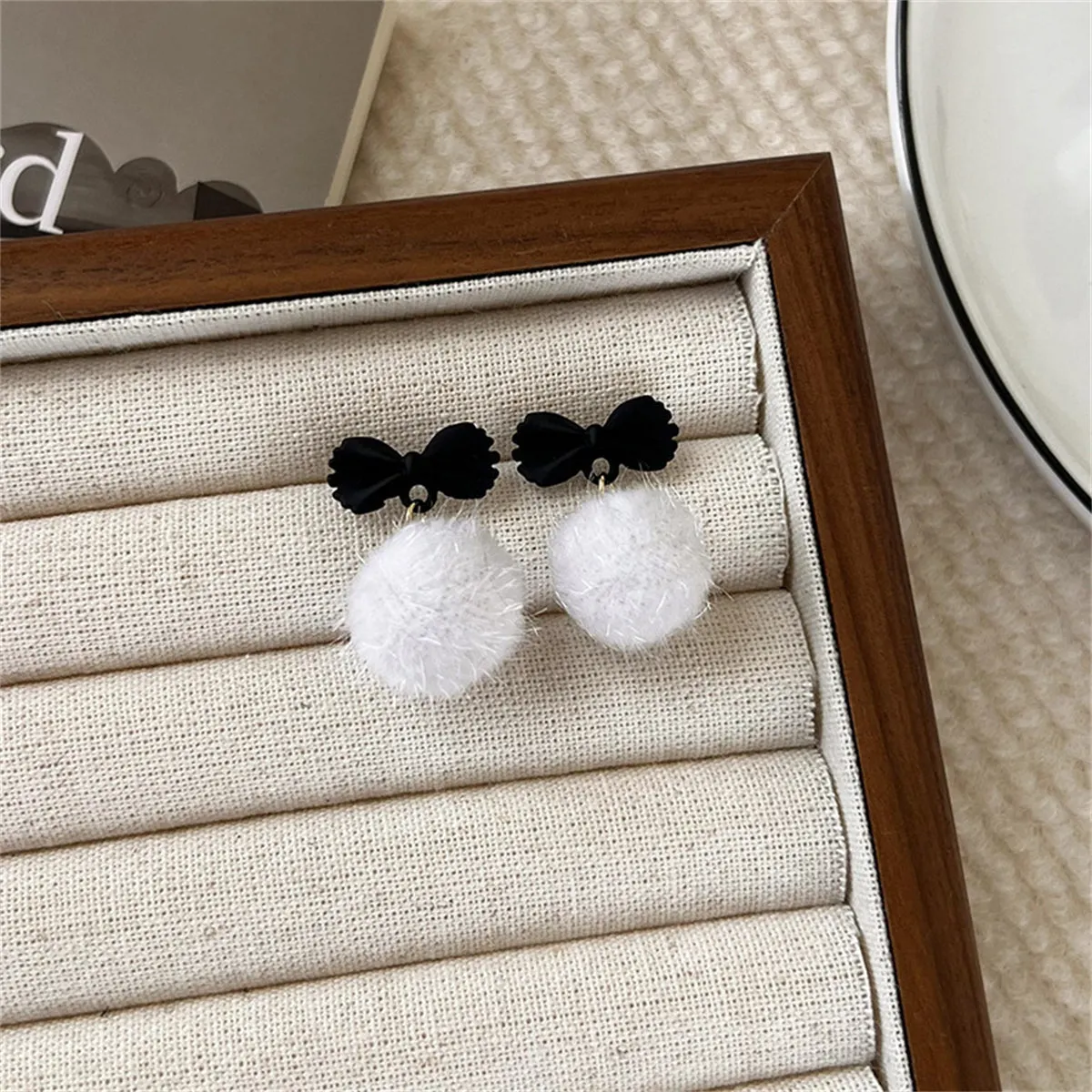 Black Enamel & White Pom-Pom Bow Drop Earrings